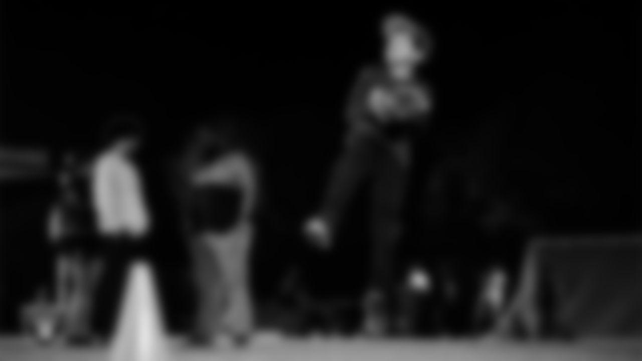 An athlete takes part in a Silver and Black League flag football clinic at Bill and Lillie Heinrich YMCA.