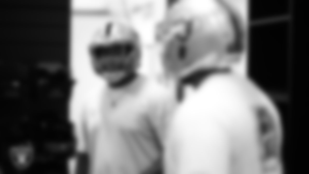 Las Vegas Raiders tackle Dominic Boyd (62) tries on a helmet in the equipment room at Intermountain Health Performance Center before the start of 2025 Rookie Minicamp.