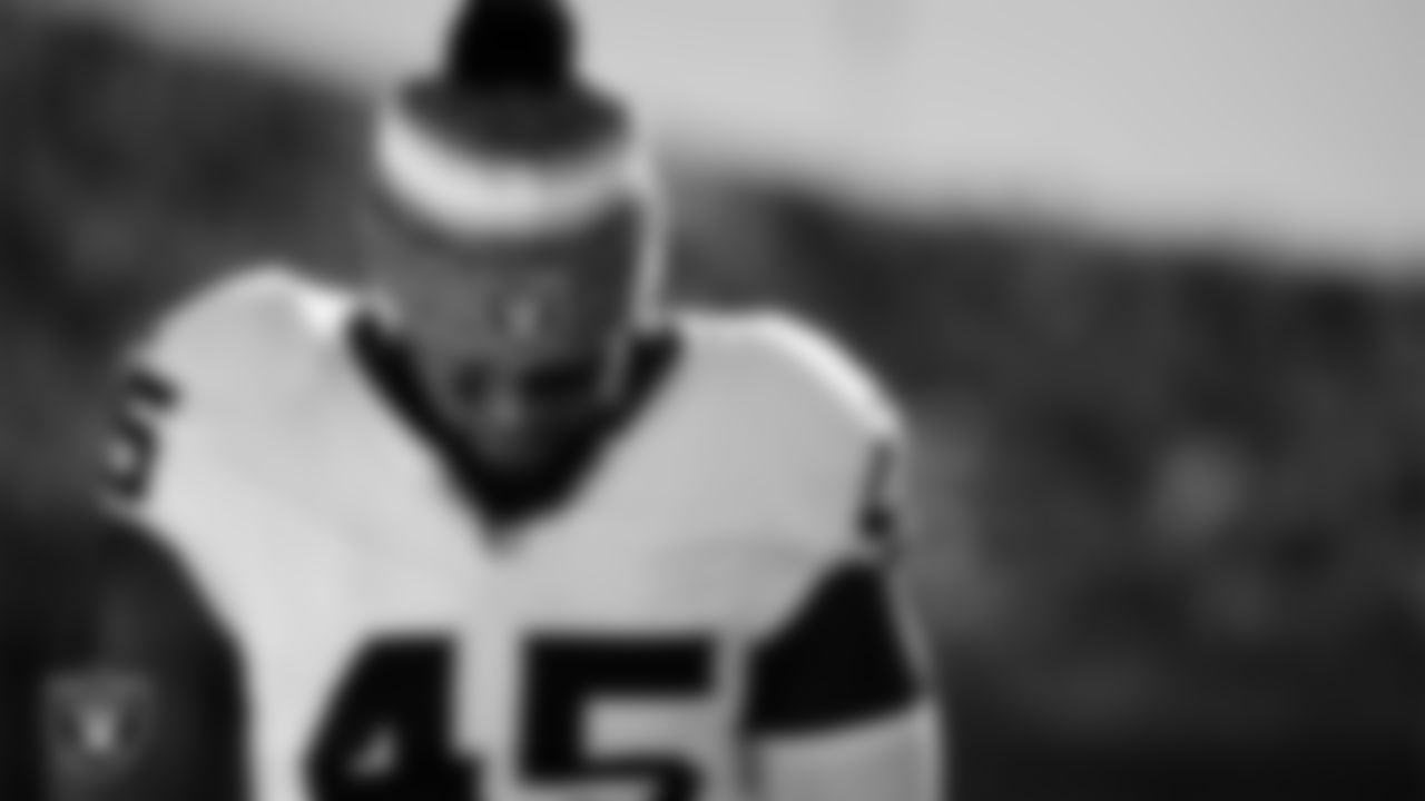 Las Vegas Raiders linebacker Devin White (45) during the national anthem before the regular season away game against the Kansas City Chiefs at GEHA Field at Arrowhead Stadium.