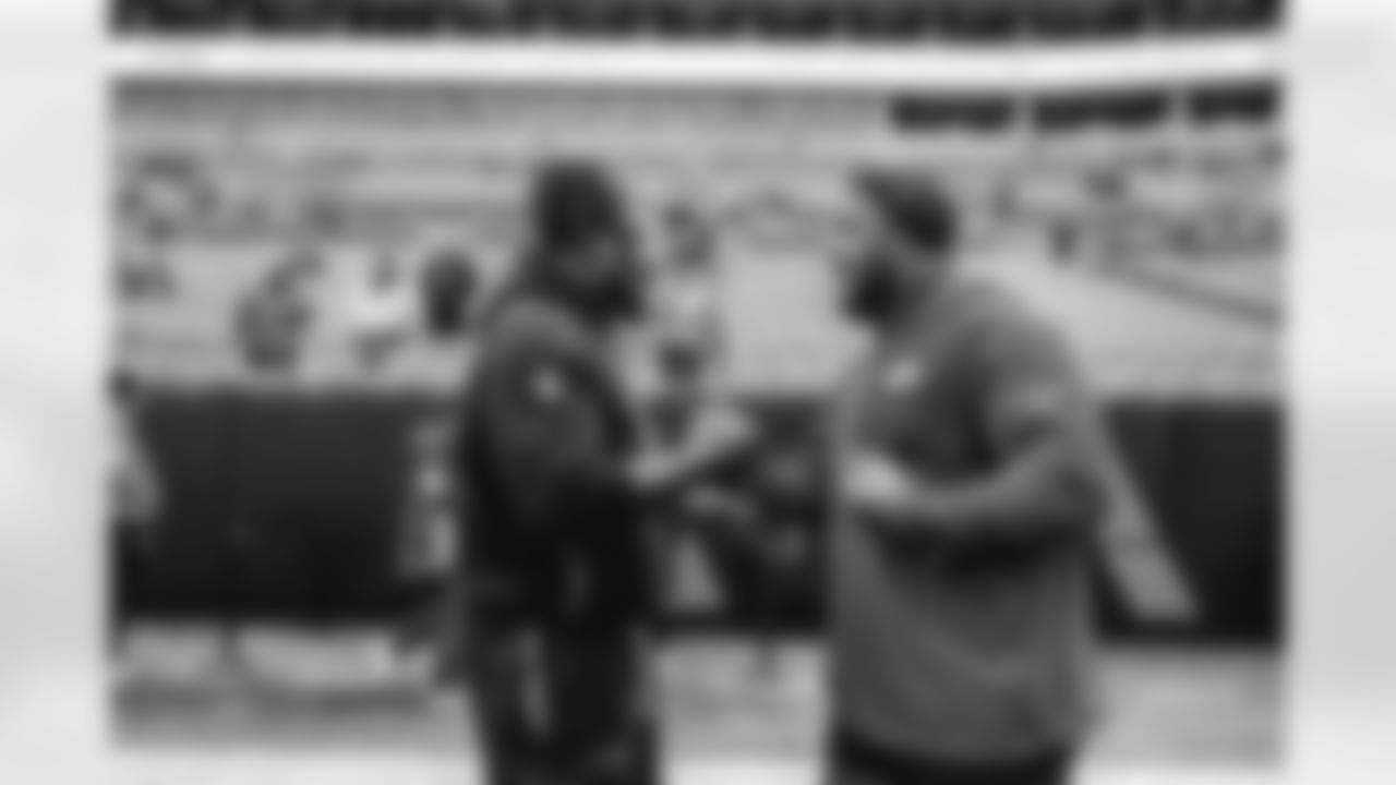 91 DE Kobie Turner meets up with Panthers DT Bobby Brown III pregame ahead of the Rams vs. Panthers Week 13 matchup