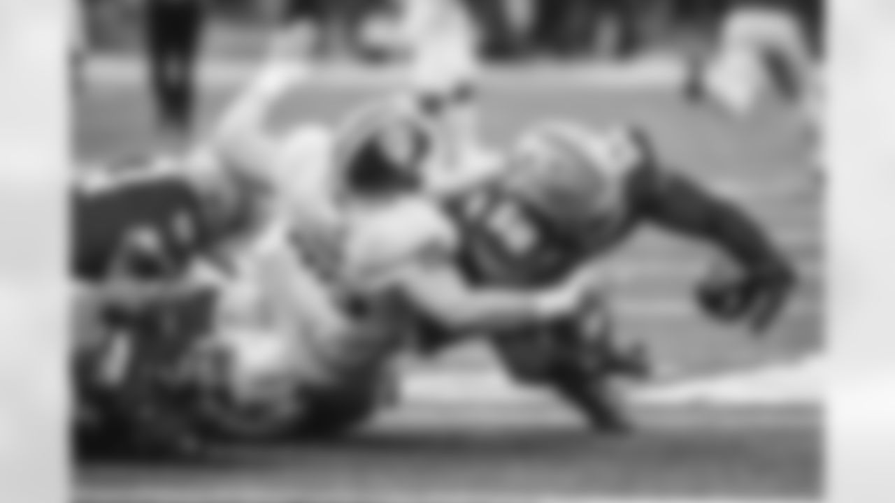 Ohio State defensive lineman Ty Hamilton, right, recovers a fumble against Indiana during the first half of an NCAA college football game Saturday, Nov. 23, 2024, in Columbus, Ohio. (AP Photo/Jay LaPrete)