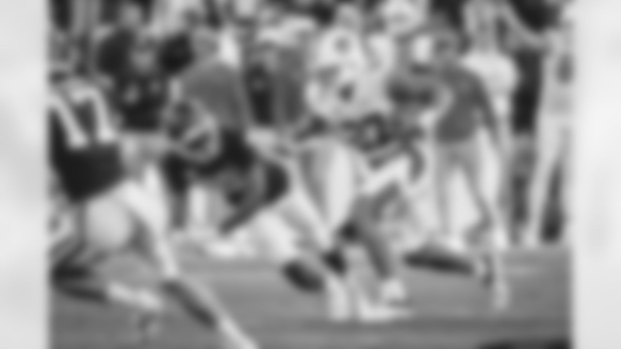 Auburn running back Jarquez Hunter (27) runs the ball past Arkansas defensive back Dwight McGlothern (2) during the second half of an NCAA college football game Saturday, Nov. 11, 2023, in Fayetteville, Ark. (AP Photo/Michael Woods)