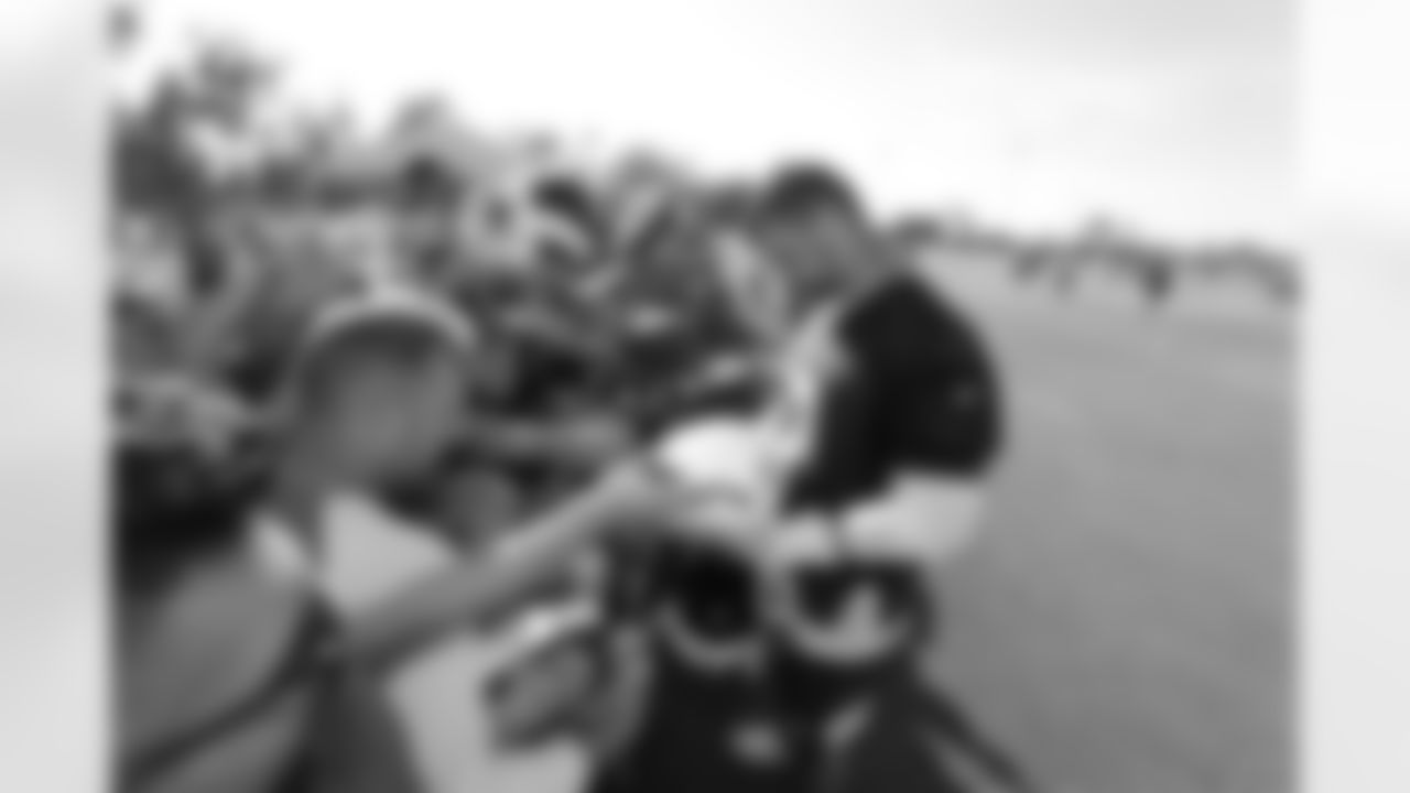 Tackle (79) Rob Havenstein of the Los Angeles Rams signs autographs with fans during Training Camp Day 02, Sunday, July 28 2019, in Irvine, CA. (Will Navarro/Rams)