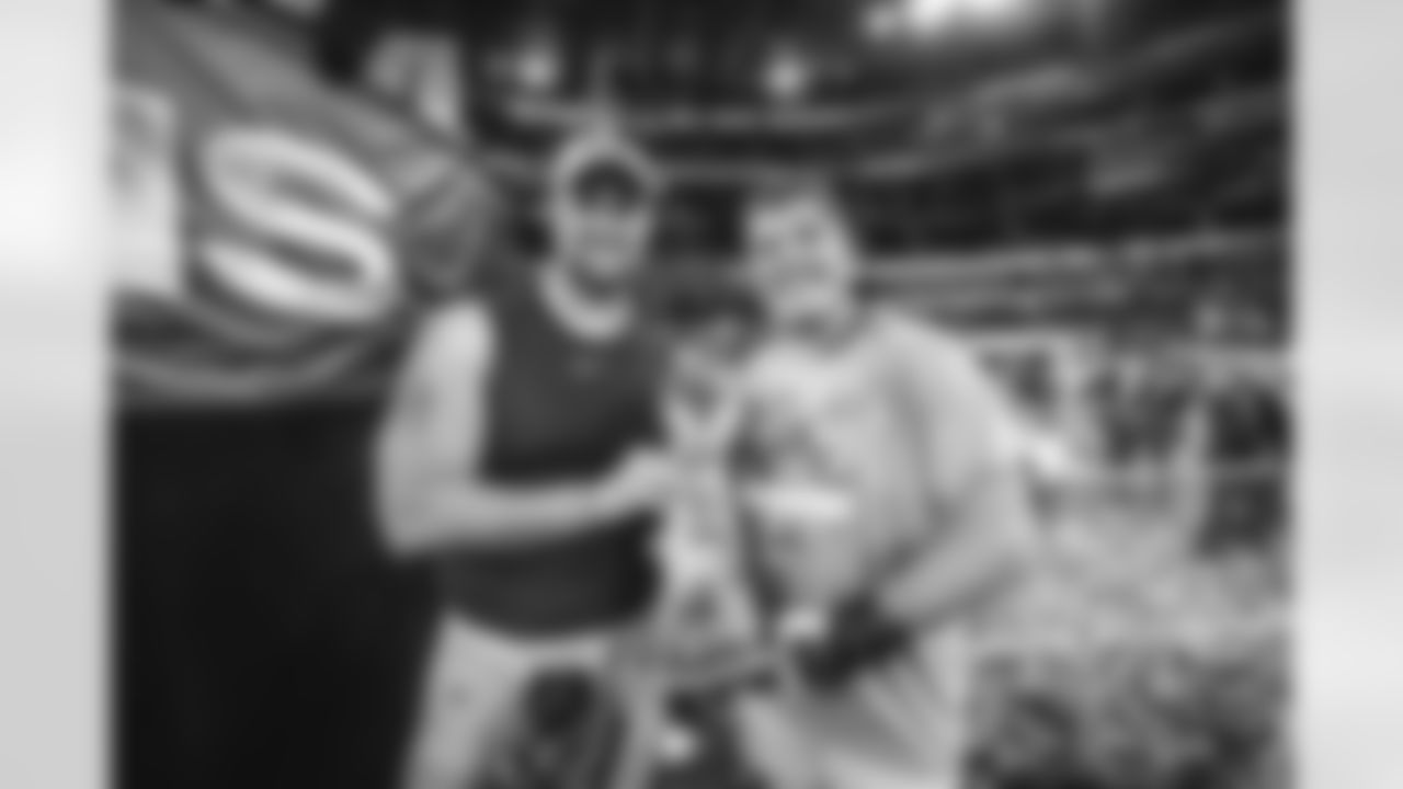 Offensive lineman (79) Rob Havenstein and Offensive lineman (63) Austin Corbett of the Los Angeles Rams celebrate holding the Vince Lombardi Trophy after defeating the Cincinnati Bengals 23-20 to win Super Bowl LVI and become NFL champions, February 13, 2022, in Inglewood, CA. (Jeff Lewis/LA Rams)