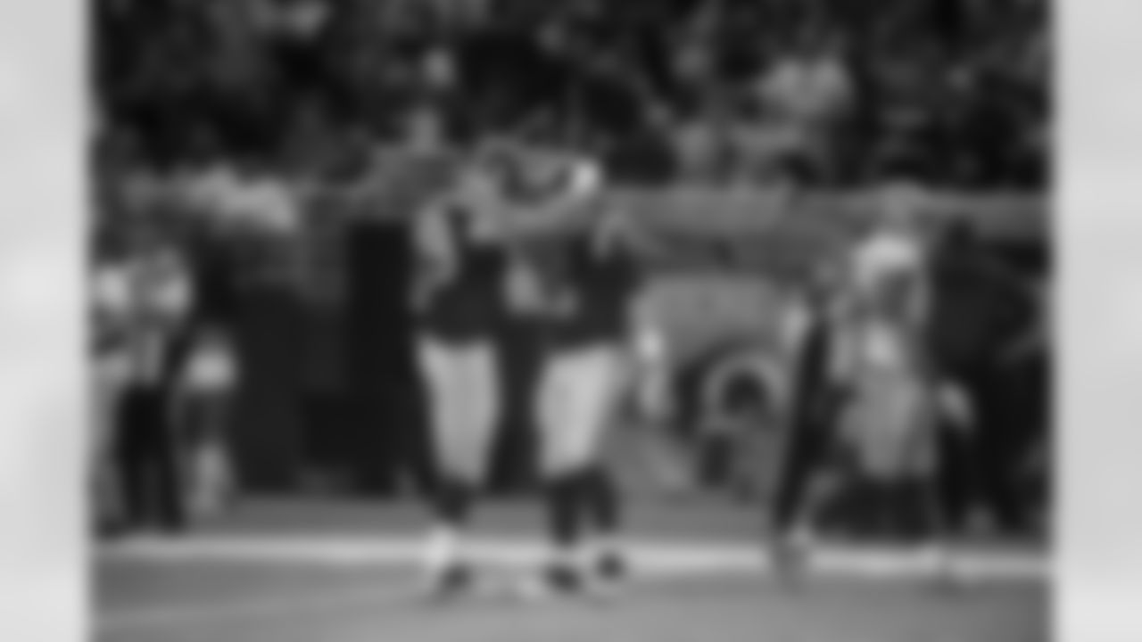 "St. Louis Rams offensive tackle Rob Havenstein and St. Louis Rams quarterback Nick Foles during the game against the San Francisco 49ers. (Photo by Scott Rovak/St. Louis Rams)"