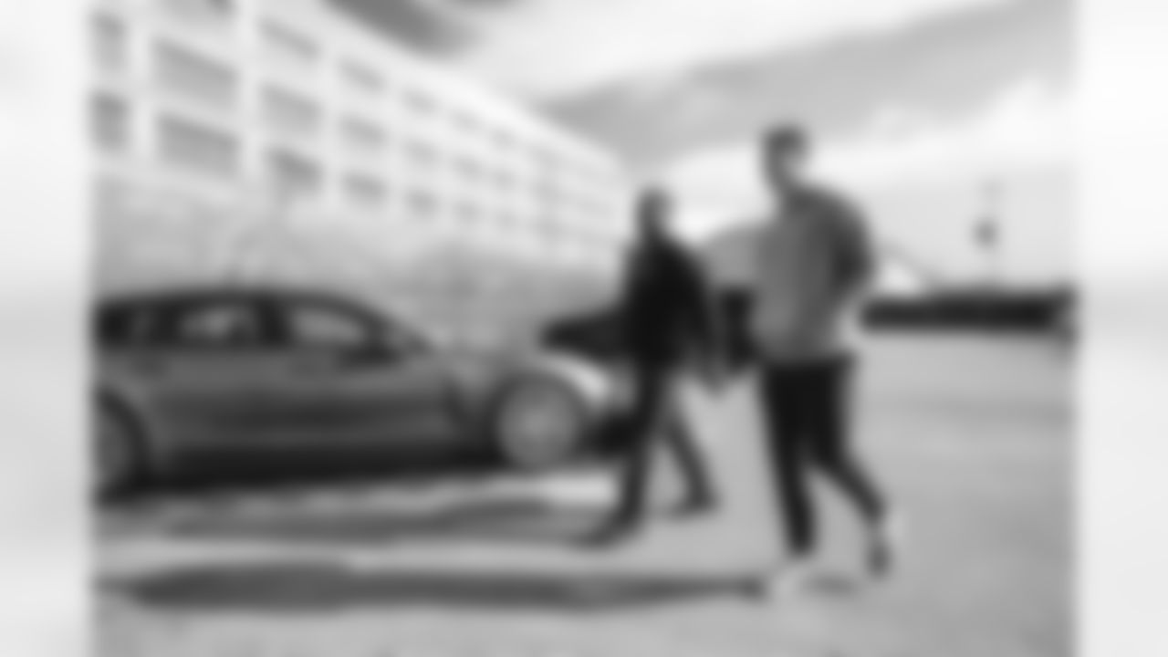 91 DE Kobie Turner and 87 TE Davis Allen arrive at SoFi Stadium for today's matchup against the Lions