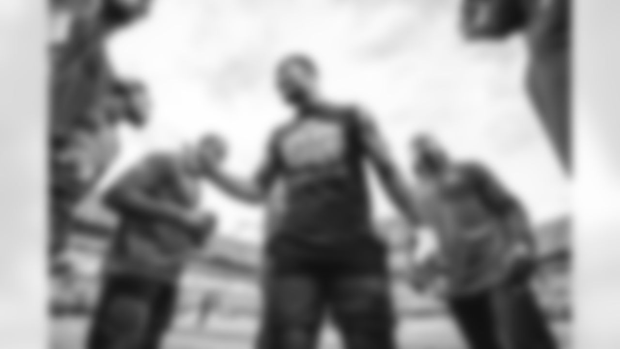 37 S Quentin Lake & players warm up pregame ahead of the Rams vs. Panthers Wild Card matchup