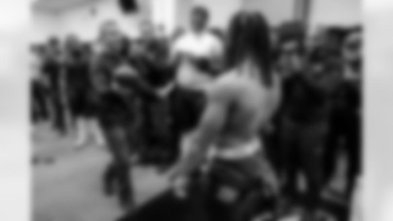 Head Coach John Harbaugh (left) & RB Keaton Mitchell (right)