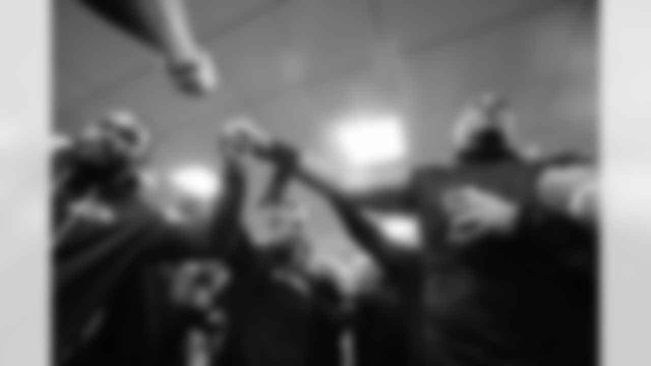 Defensive Coordinator Zach Orr (left), Head Coach John Harbaugh (middle), & T Carson Vinson (right)