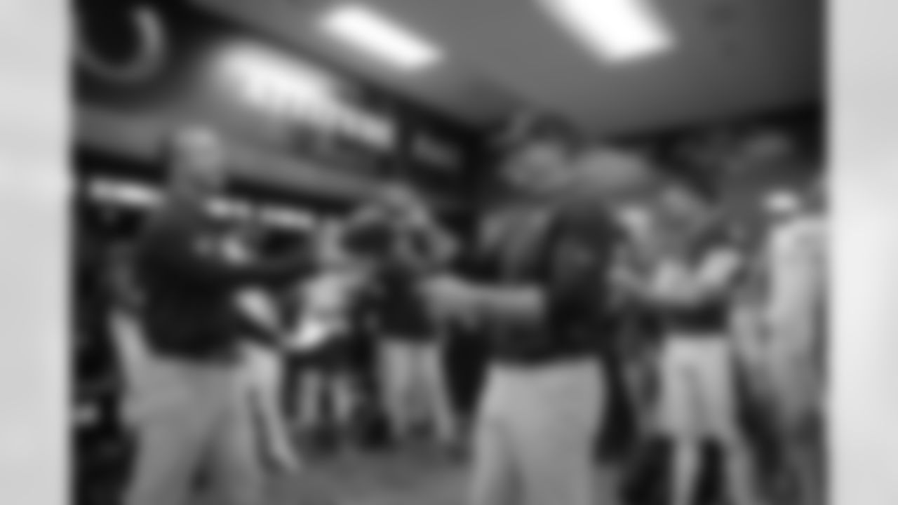 The Ravens' celebrated in the locker room following a 37-3 victory over the Seattle Seahawks.