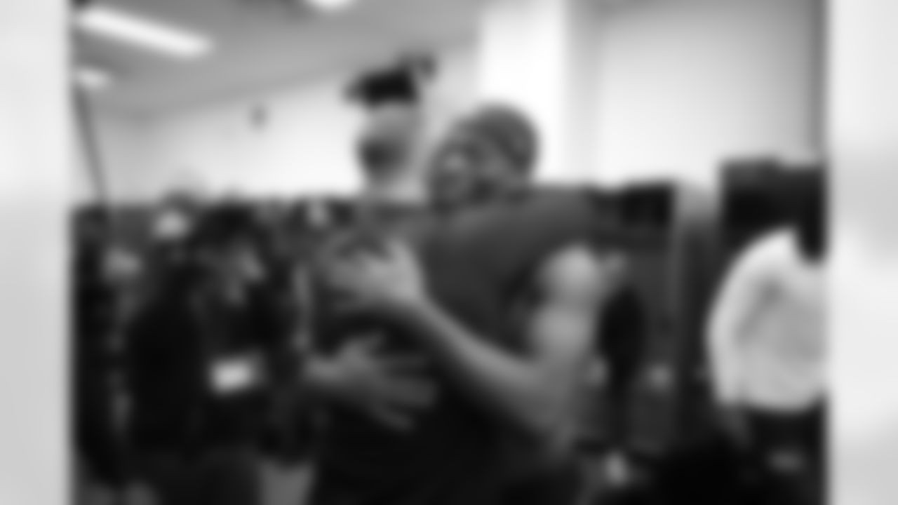 Head Coach John Harbaugh (left) & S Malaki Starks (right)