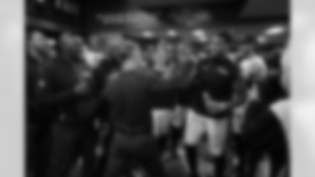 (left) Head Coach John Harbaugh & (right) DE Dre'Mont Jones