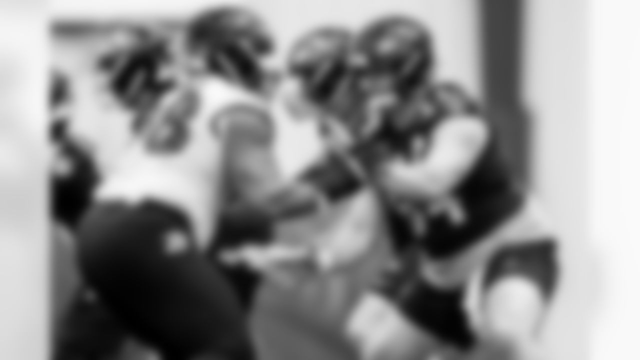 DL Travis Jones (left) & C Tyler Linderbaum (right)