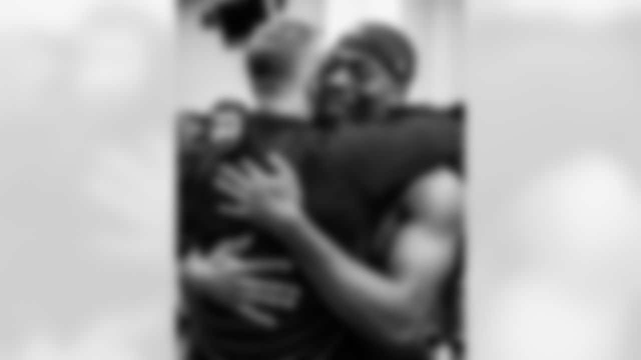 Head Coach John Harbaugh (left) & S Malaki Starks (right)