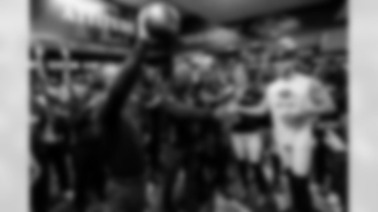 Head Coach John Harbaugh (left) & P Jordan Stout (right)