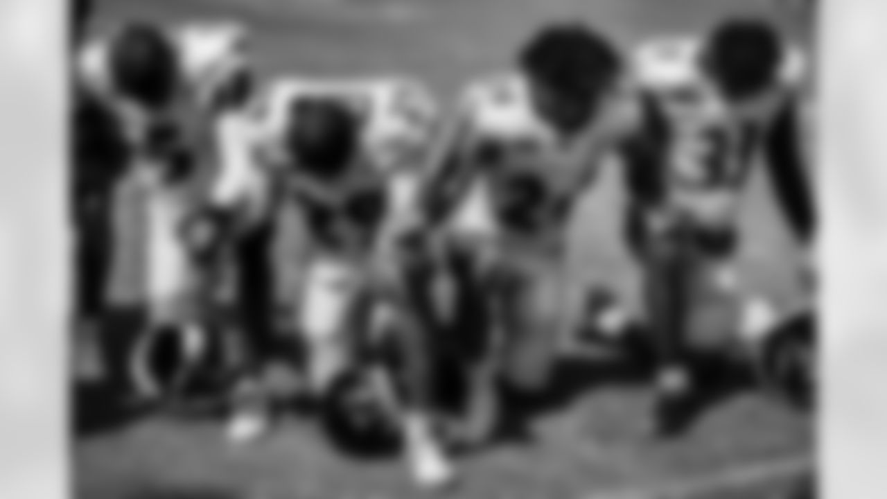Ravens cornerbacks praying.