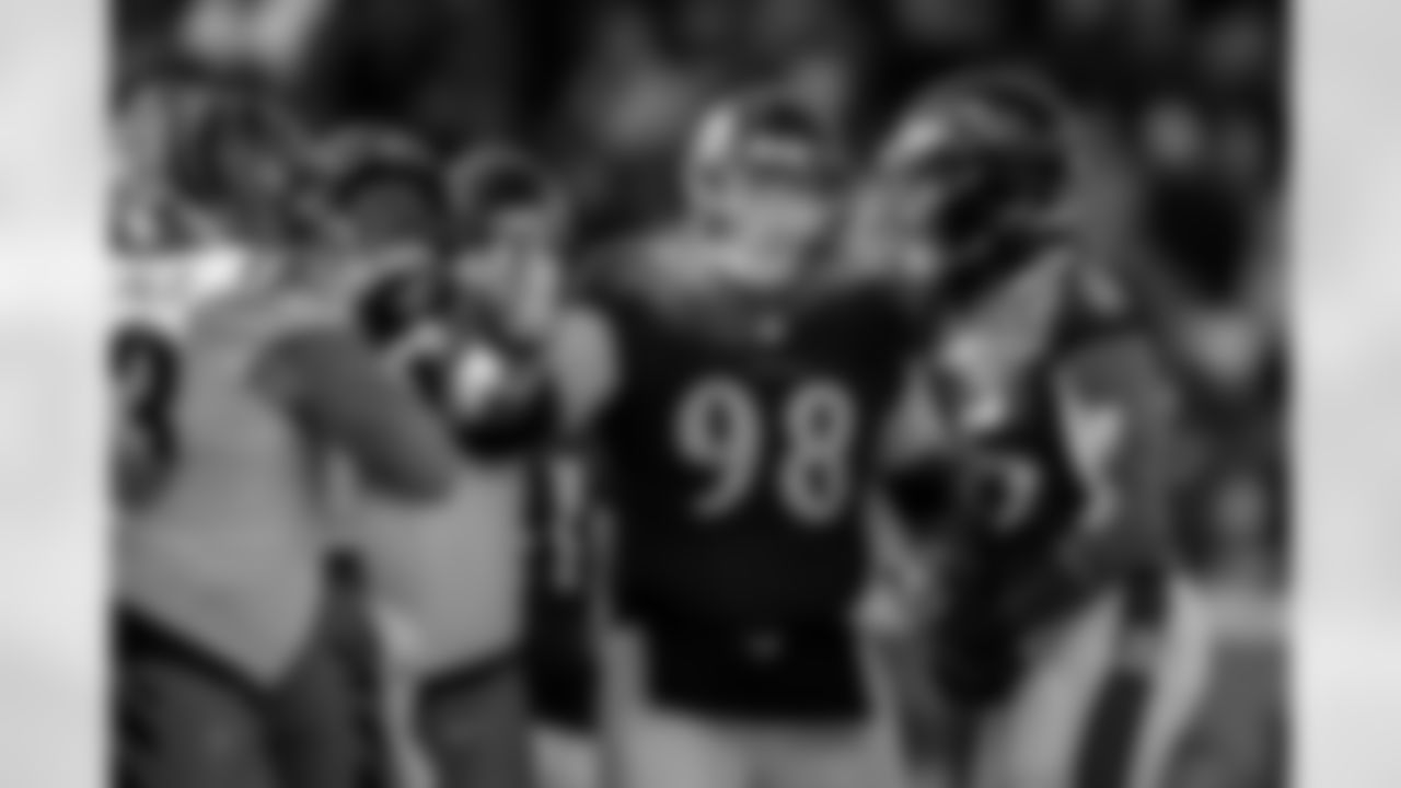 DT Travis Jones (middle) & OLB Tavius Robinson (right)