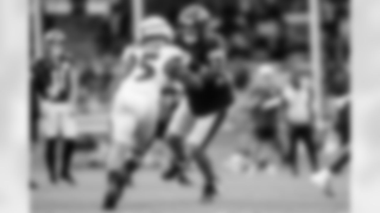 OLB Tavius Robinson (left) & RT Roger Rosengarten (right)