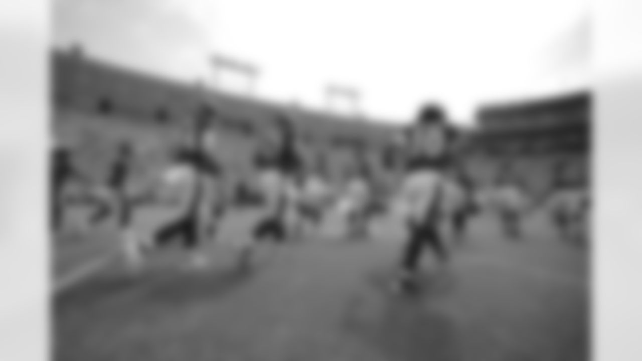 Players running onto the field.
