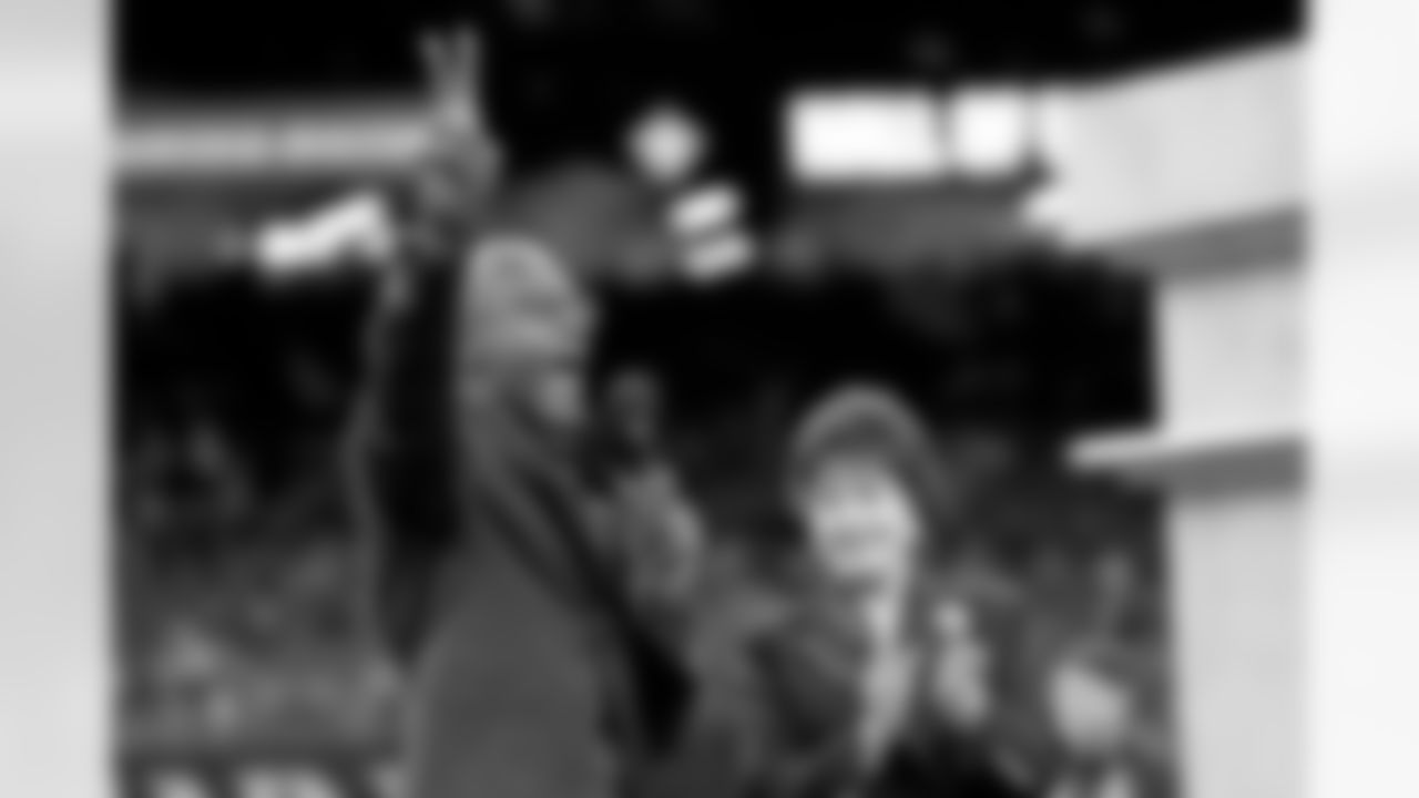 New Orleans Saints owner Gayle Benson presents Brett Maxie and Tracy Porter with their Saints Hall of Fame jackets during a ceremony on the field before the game against the Carolina Panthers on Sunday, Dec. 14, 2025 in New Orleans. (Michael DeMocker/ NFL LCC)