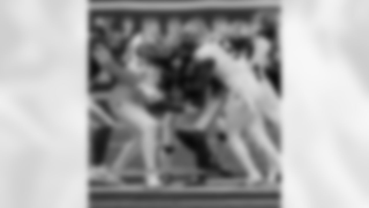 DE Cameron Jordan (94) and DB Will Harris (5) make a tackle during the New Orleans Saints game against the New York Giants for Week 14 of the 2024 NFL Season on Dec. 8, 2024 at MetLife Stadium.