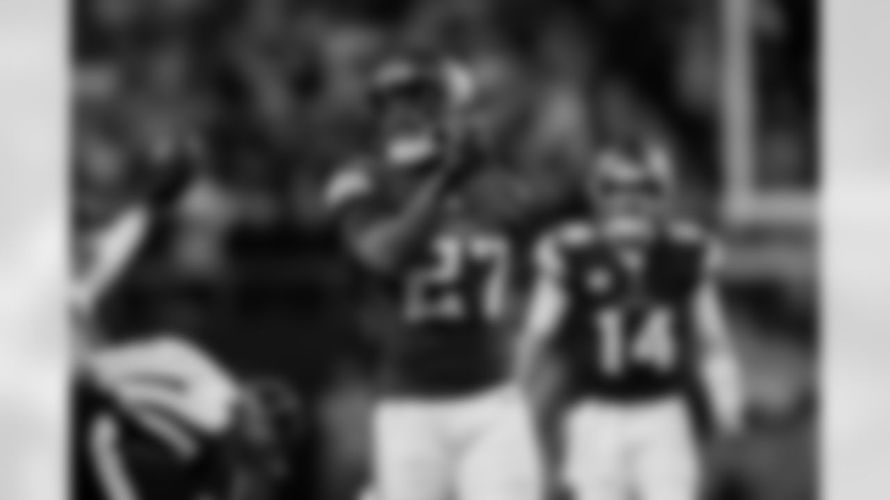 Minnesota Vikings running back Cam Akers (27) reacts after completing a pass for a first down during the second half of an NFL football game against the Green Bay Packers, Sunday, Dec. 29, 2024 in Minneapolis. Minnesota won 27-25.