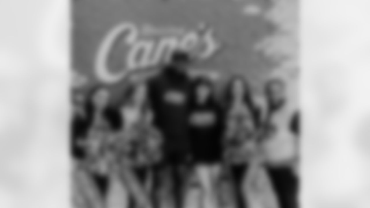 New Orleans Saints tight end Juwan Johnson and his wife Chanen joined Take Paws Rescue for a pet adoption event at the Raising Cane's on Veterans Boulevard on Tuesday, November 21, 2023.
