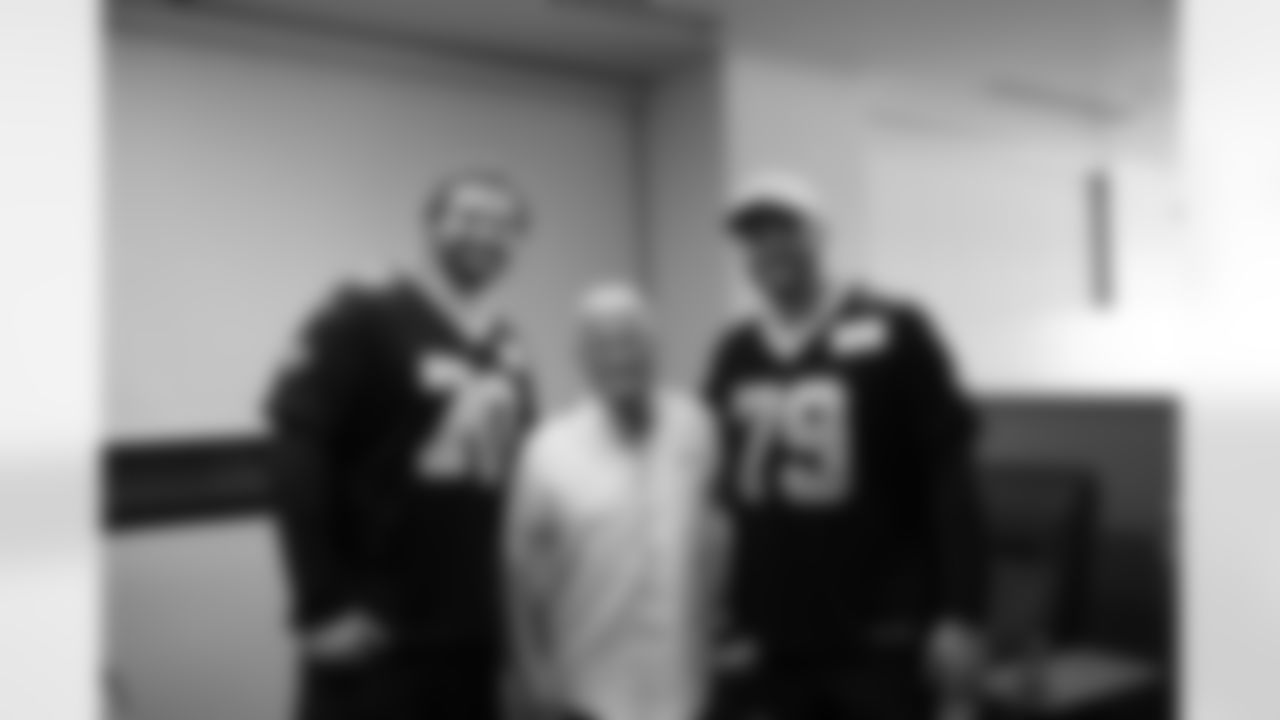 New Orleans Saints players Trevor Penning and Luke Fortner surprised patients and their families at the Gayle and Tom Benson Cancer Center on October 7, 2025 as part of the NFL's Crucial Catch month.