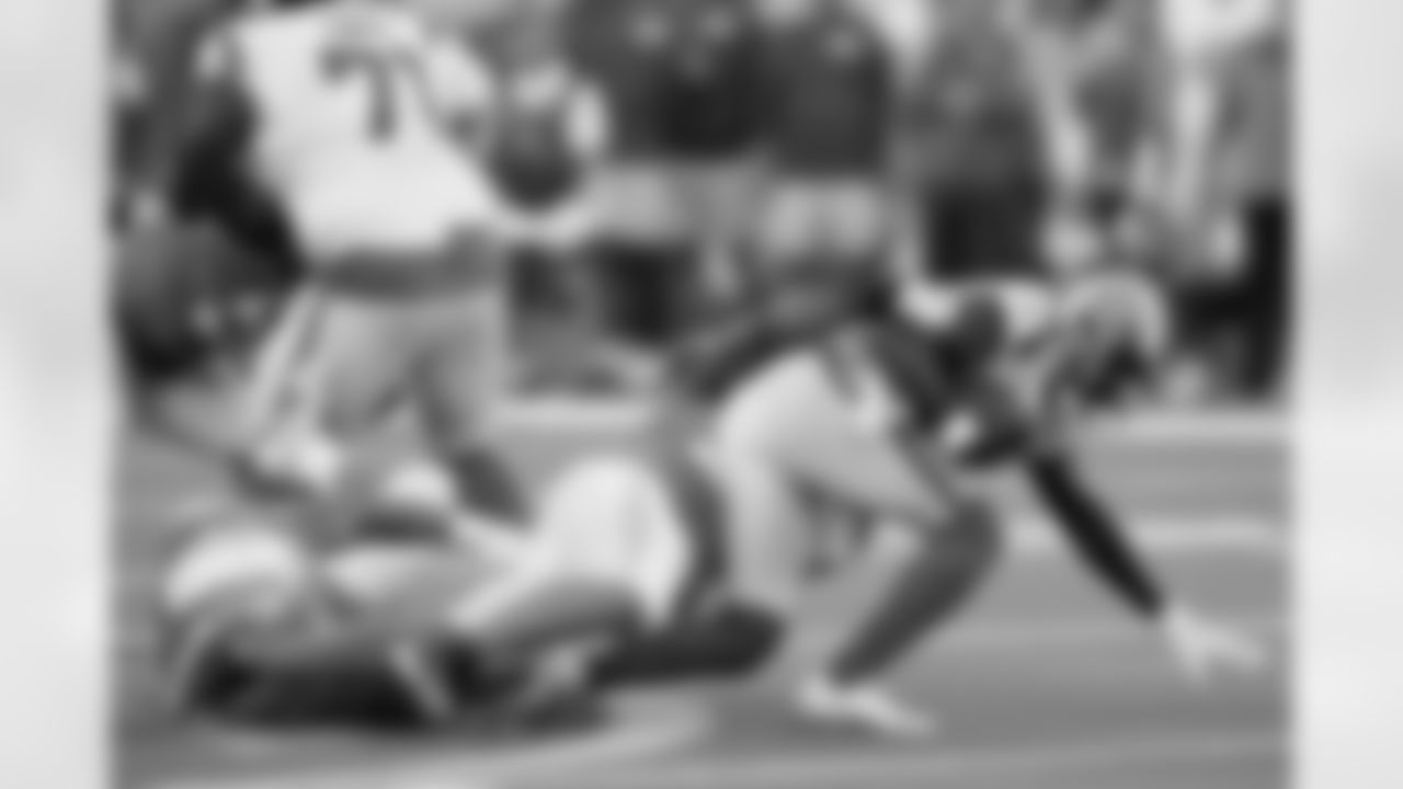 Los Angeles Rams quarterback Bryce Perkins, right, is sacked by Los Angeles Chargers' Chris Rumph II during the first half of a preseason NFL football game Saturday, Aug. 13, 2022, in Inglewood, Calif.