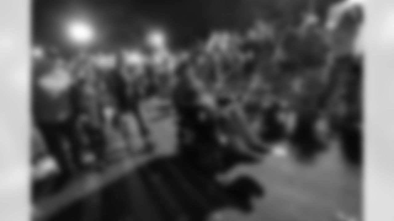 Former New Orleans Saints Steve Gleason, who suffers from amyotrophic lateral sclerosis, rides with members of his charity "No White Flags" in the Krewe of Bacchus Mardi Gras parade in New Orleans, Sunday, Feb. 26, 2017.