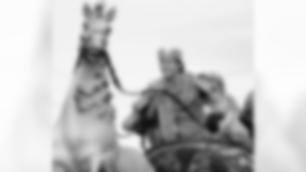 New Orleans Saints Quarterback Drew Brees and Super Bowl MVP grabs the reigns of the horse on his float as he prepares to ride in the Bacchus Mardi Gras in New Orleans, Sunday, Feb. 14, 2010. The Saints won Super Bowl XLIV on Feb. 7.