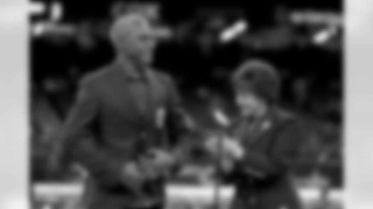 New Orleans Saints owner Gayle Benson presents Brett Maxie and Tracy Porter with their Saints Hall of Fame jackets during a ceremony on the field before the game against the Carolina Panthers on Sunday, Dec. 14, 2025 in New Orleans. (Michael DeMocker/ NFL LCC)