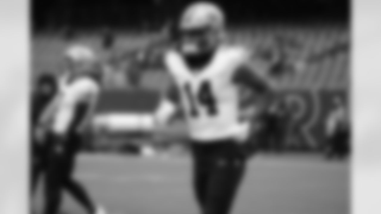 WR Devaughn Vele (14) runs onto the field during the New Orleans Saints game against the Chicago Bears for Week 7 of the 2025 NFL season on Oct. 19, 2025 at Soldier Field.