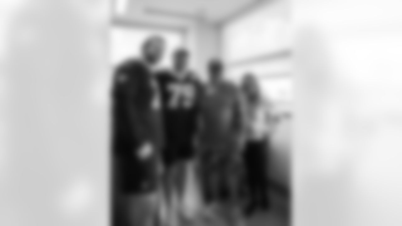 New Orleans Saints players Trevor Penning and Luke Fortner surprised patients and their families at the Gayle and Tom Benson Cancer Center on October 7, 2025 as part of the NFL's Crucial Catch month.