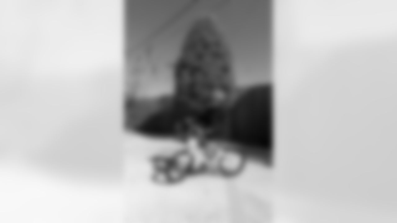 New Orleans Saints quarterback Tyler Shough and defensive end Cam Jordan joined Raising Cane's to surprise 100 kids from the Boys and Girls Club of Metro Louisiana with new bikes and helmets for the holidays on Tuesday, Dec. 9, 2025.