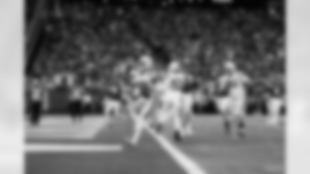 Indianapolis Colts safety Julian Blackmon (32) runs back an interception to score a touchdown during an NFL football game against the Minnesota Vikings, Saturday, Dec. 17, 2022, in Minneapolis.