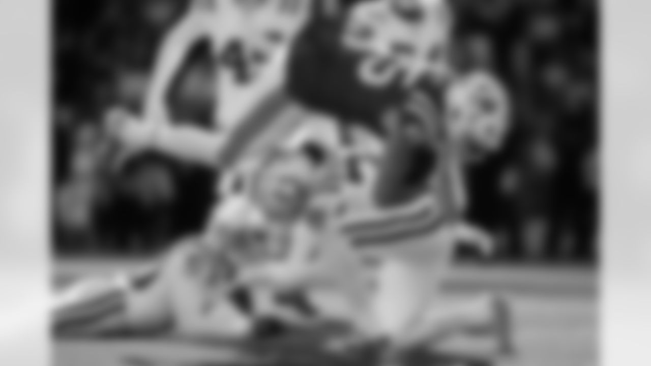Indianapolis Colts safety Julian Blackmon (32) brings down New England Patriots tight end Hunter Henry (85) during the first half of an NFL football game, Sunday, Dec. 1, 2024, in Foxborough, Mass.