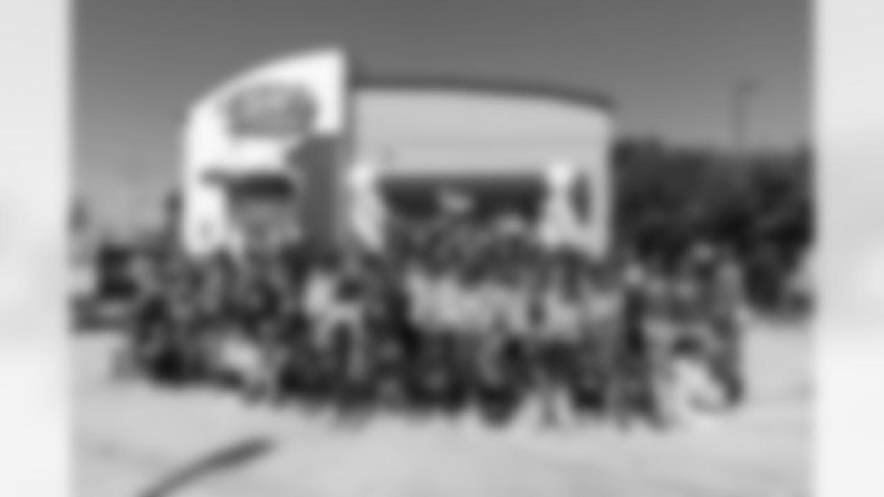 New Orleans Saints quarterback Tyler Shough and defensive end Cam Jordan joined Raising Cane's to surprise 100 kids from the Boys and Girls Club of Metro Louisiana with new bikes and helmets for the holidays on Tuesday, Dec. 9, 2025.