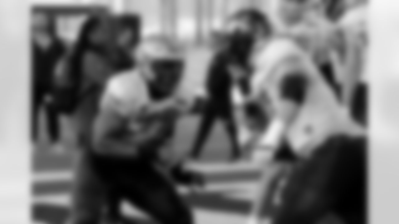 National Team offensive lineman Zion Johnson of Boston College (77) and National Team offensive lineman Trevor Penning of Northern Iowa (70) run through drills during practice for the Senior Bowl NCAA college football game Thursday, Feb. 3, 2022, in Mobile, Ala.