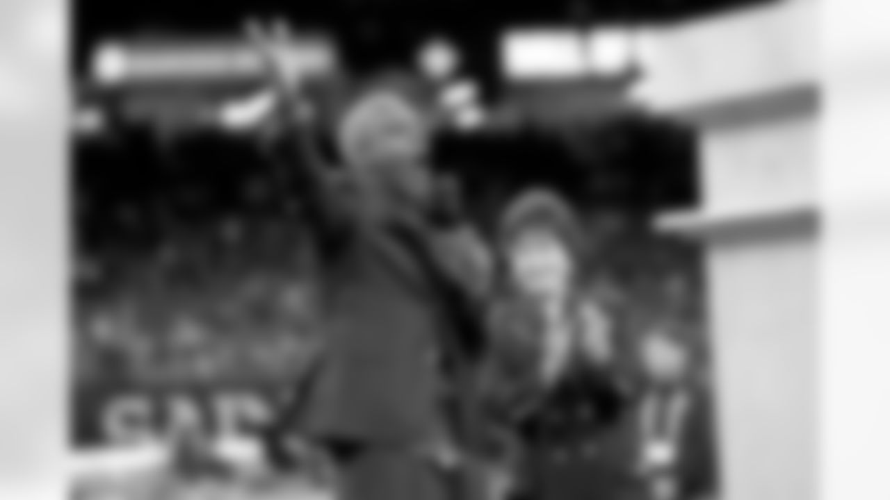 New Orleans Saints owner Gayle Benson presents Brett Maxie and Tracy Porter with their Saints Hall of Fame jackets during a ceremony on the field before the game against the Carolina Panthers on Sunday, Dec. 14, 2025 in New Orleans. (Michael DeMocker/ NFL LCC)