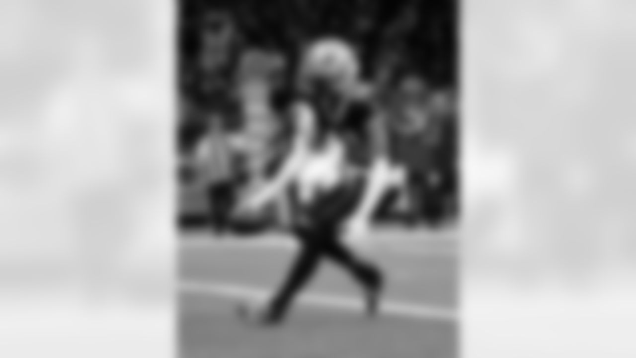 WR Chris Olave (12) scores a touchdown during the New Orleans Saints game against the Carolina Panthers for Week 15 of the 2025 NFL season on Dec. 14, 2025 at the Caesars Superdome.