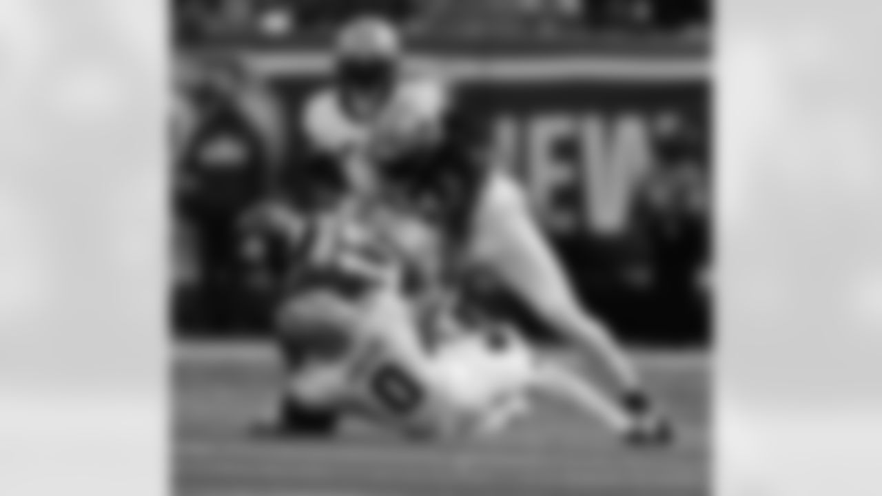 S Ugo Amadi (0) and LB Demario Davis (56) go in for the tackle during the New Orleans Saints game against the New York Giants for Week 14 of the 2024 NFL Season on Dec. 8, 2024 at MetLife Stadium.