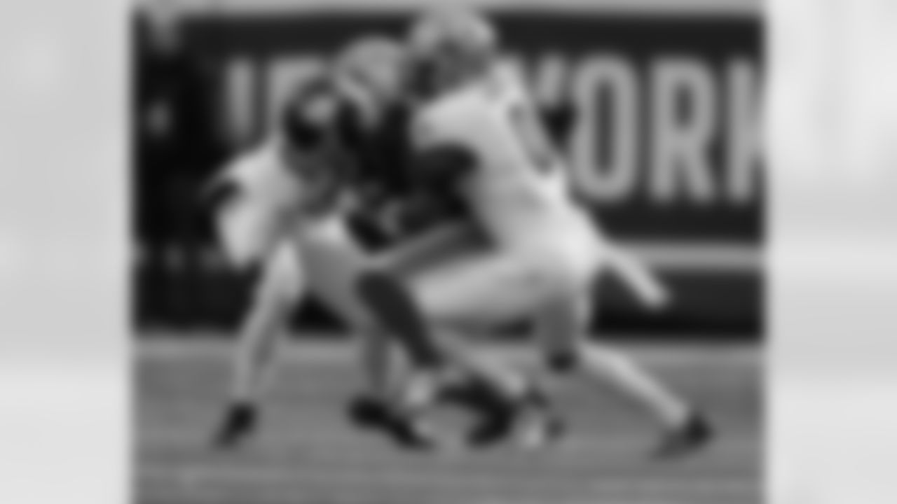 S Ugo Amadi (0) and LB Demario Davis (56) go in for the tackle during the New Orleans Saints game against the New York Giants for Week 14 of the 2024 NFL Season on Dec. 8, 2024 at MetLife Stadium.