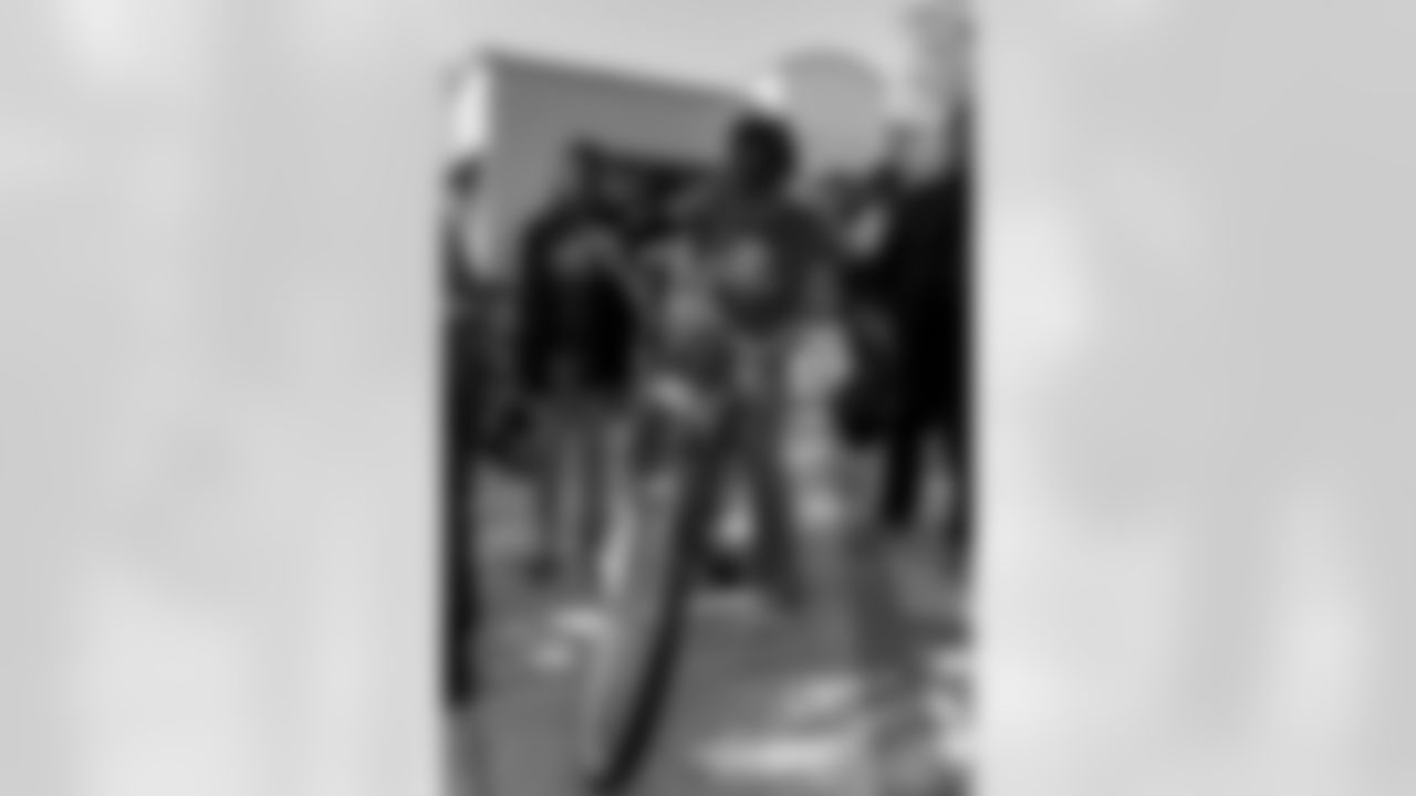 New Orleans Saints quarterback Tyler Shough and defensive end Cam Jordan joined Raising Cane's to surprise 100 kids from the Boys and Girls Club of Metro Louisiana with new bikes and helmets for the holidays on Tuesday, Dec. 9, 2025.