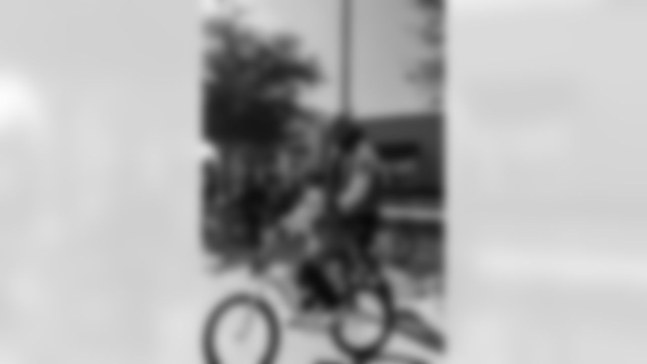 New Orleans Saints quarterback Tyler Shough and defensive end Cam Jordan joined Raising Cane's to surprise 100 kids from the Boys and Girls Club of Metro Louisiana with new bikes and helmets for the holidays on Tuesday, Dec. 9, 2025.