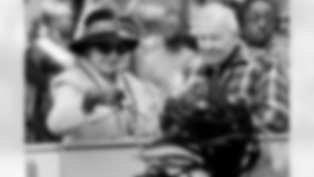 Photos of New Orleans Saints owner Gayle Benson enjoying Mardi Gras day outside of Gallier Hall on Tuesday, Feb. 13, 2024.