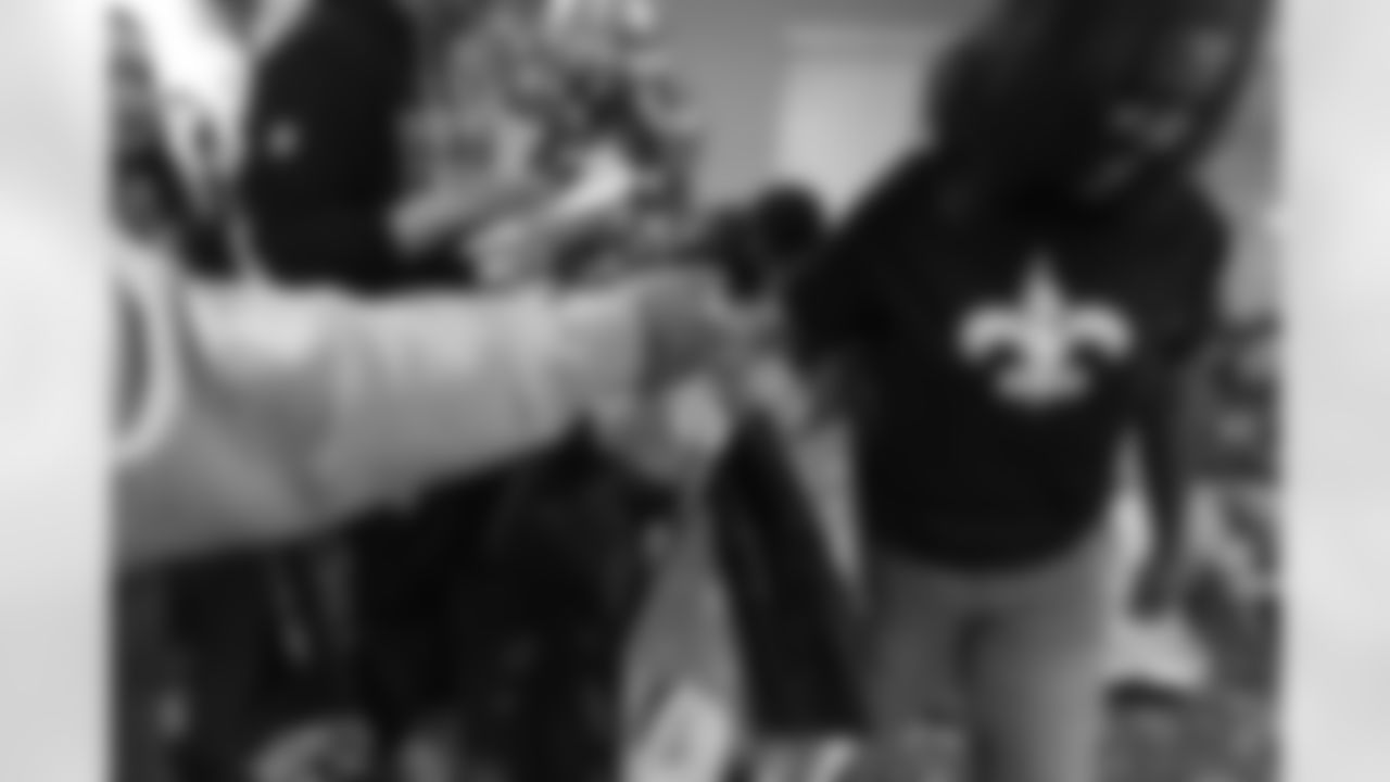 New Orleans Saints tight end Juwan Johnson, cornerback Alontae Taylor, and wide receiver Devaughn Vele attended the Louisiana Cat Hope Ignites Holiday Party on Tuesday, Dec. 16, 2025.