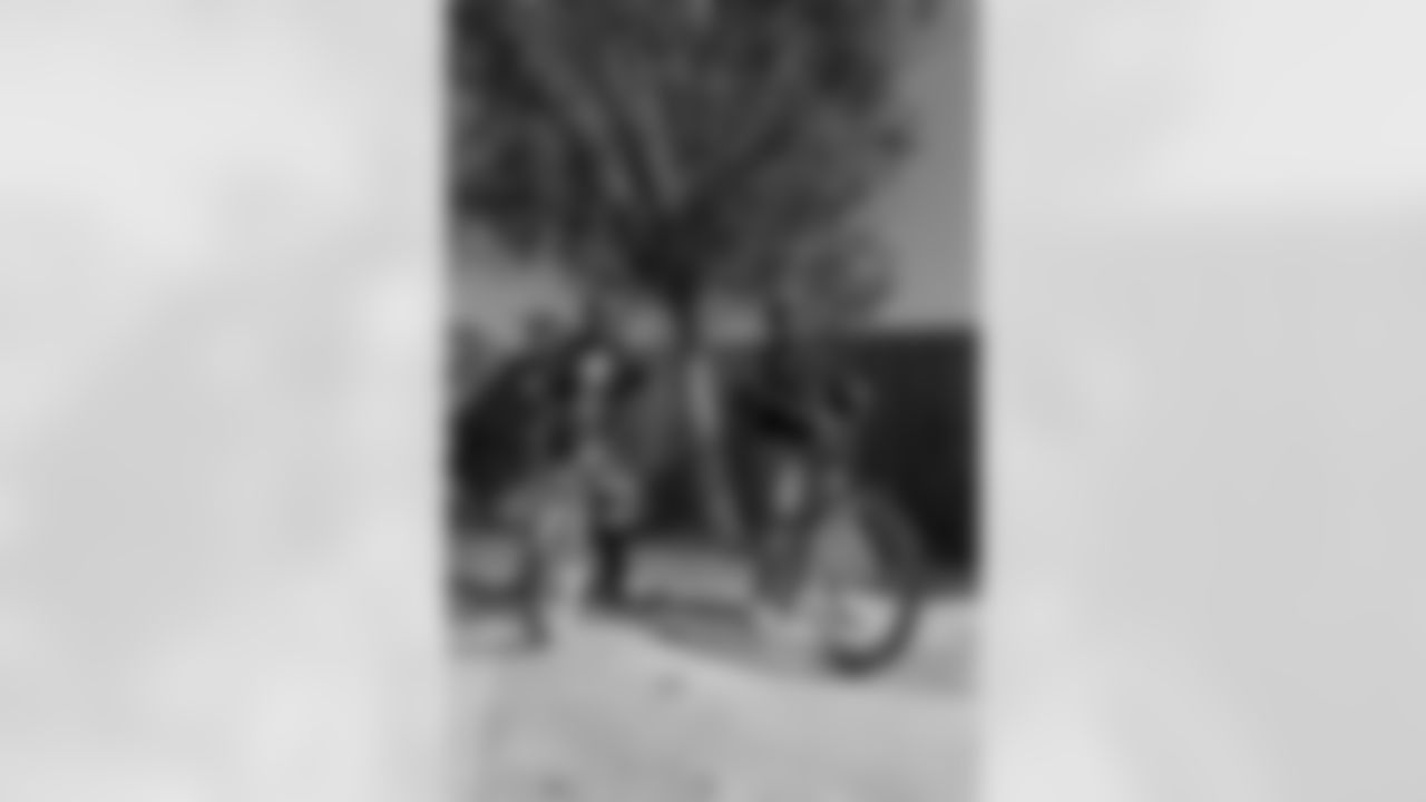 New Orleans Saints quarterback Tyler Shough and defensive end Cam Jordan joined Raising Cane's to surprise 100 kids from the Boys and Girls Club of Metro Louisiana with new bikes and helmets for the holidays on Tuesday, Dec. 9, 2025.