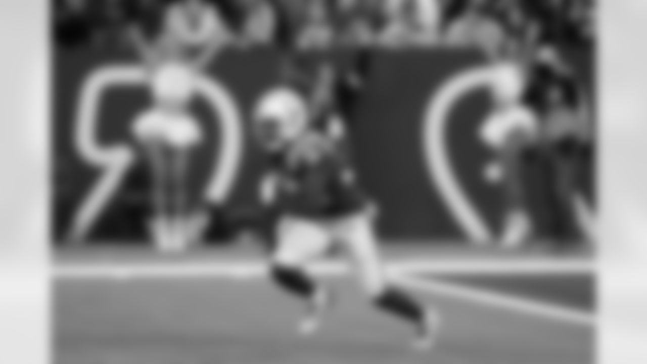 Indianapolis Colts safety Julian Blackmon (32) runs with the ball after making an interception during the second half of an NFL football game against the Jacksonville Jaguars, Sunday, Jan. 5, 2025, in Indianapolis.