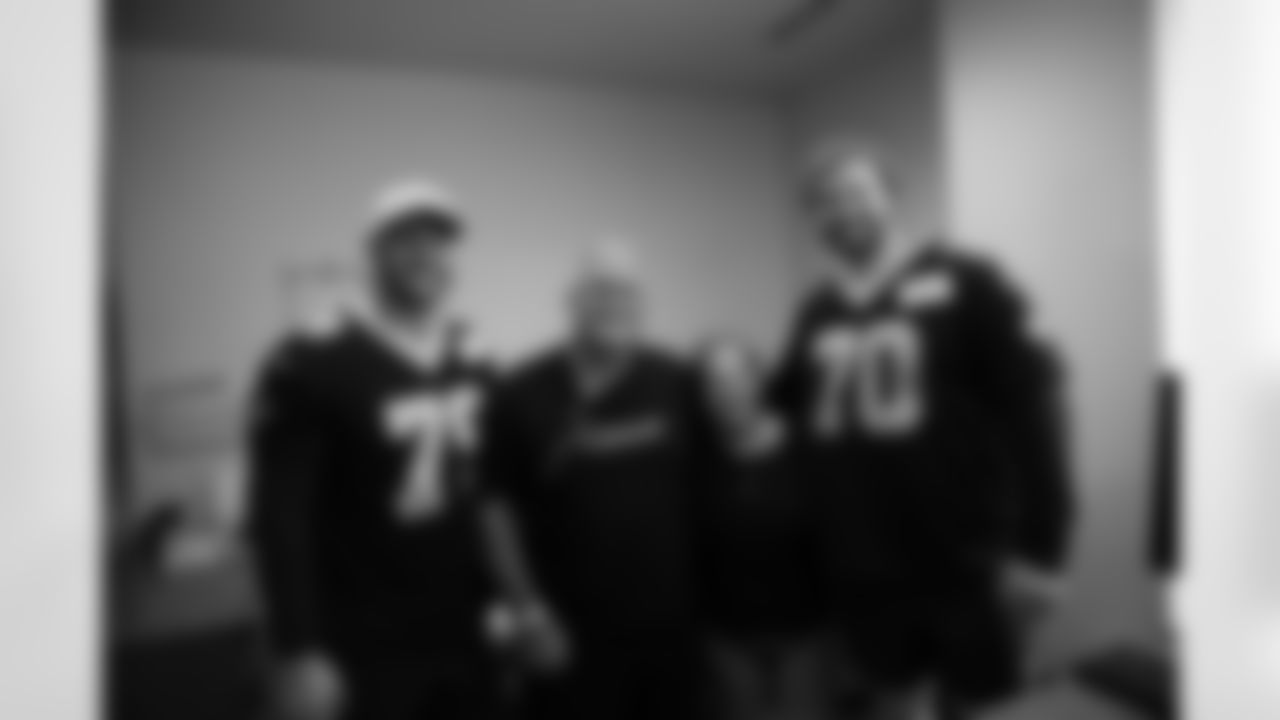 New Orleans Saints players Trevor Penning and Luke Fortner surprised patients and their families at the Gayle and Tom Benson Cancer Center on October 7, 2025 as part of the NFL's Crucial Catch month.